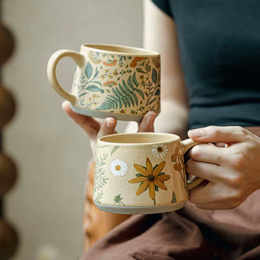 Holding Enchanting Botanicals Ceramic Mugs With Floral Patterns